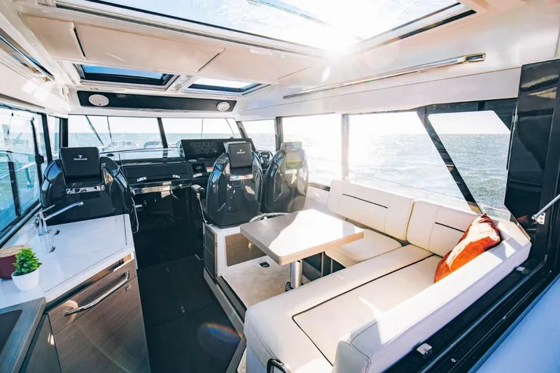 Slide: The Image of Luxurious interior of 2025 Wellcraft 38 Explorer yacht with modern seating and panoramic windows. - 6
