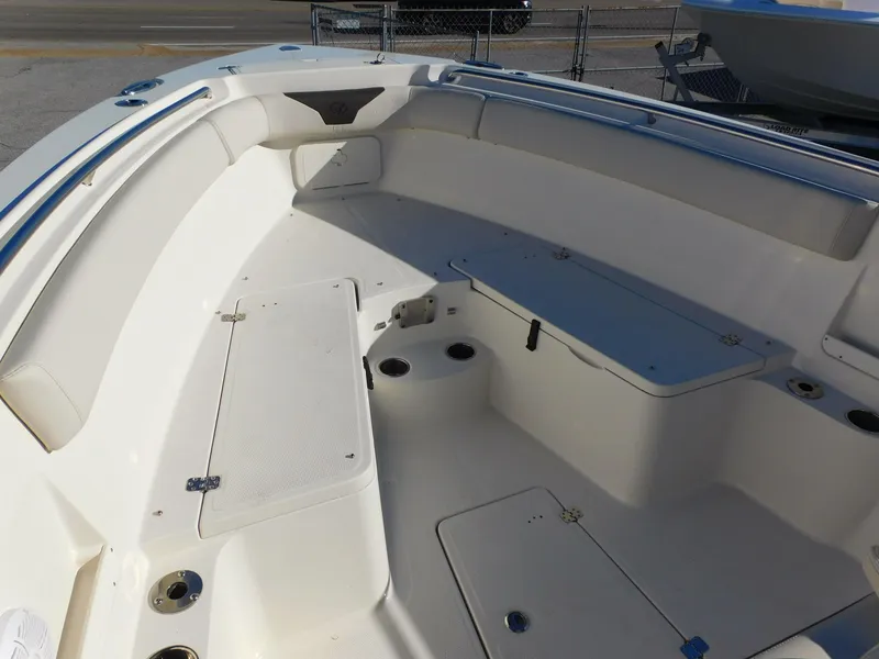 Slide: The Image of 2023 Sailfish 290 CC boat interior with seating and storage compartments. - 19