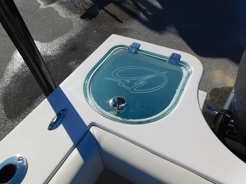 Slide: The Image of Sailfish 290 CC 2023 boat detail with glass hatch and logo. - 26
