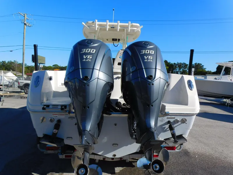 Slide: The Image of 2023 Sailfish 290 CC boat with dual 300 V6 engines, rear view. - 4