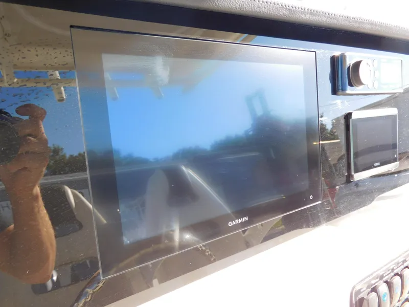 Slide: The Image of Garmin display on 2023 Sailfish 290 CC boat dashboard. - 8