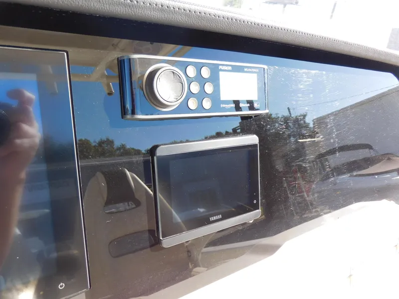 Slide: The Image of 2023 Sailfish 290 CC dashboard with modern control panel and display screen. - 9