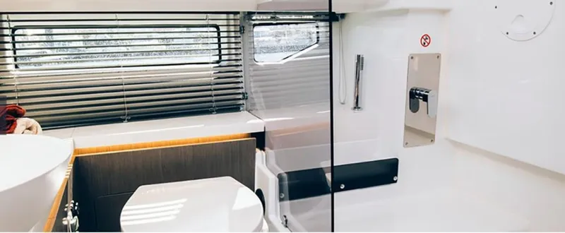 Slide: The Image of Modern bathroom interior of 2025 Wellcraft 38 Explorer yacht with sleek design and window blinds. - 10