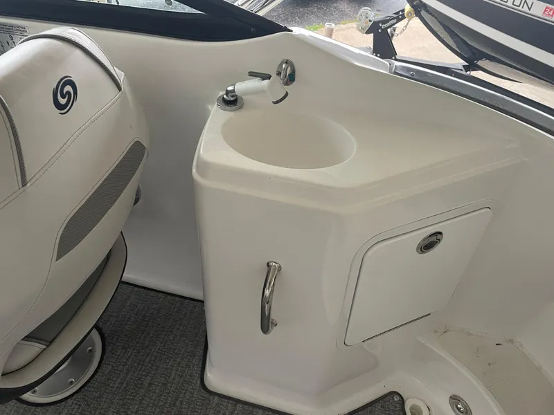 Slide: The Image of 2022 Hurricane SunDeck 2200 DC OB boat interior with sink and seating. - 13