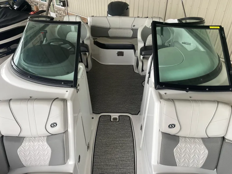 Slide: The Image of 2022 Hurricane SunDeck 2200 DC OB interior with dual consoles and seating. - 14