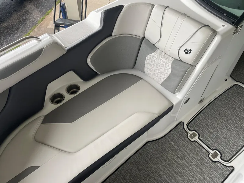Slide: The Image of 2022 Hurricane SunDeck 2200 DC OB boat interior with stylish seating and cup holders. - 17