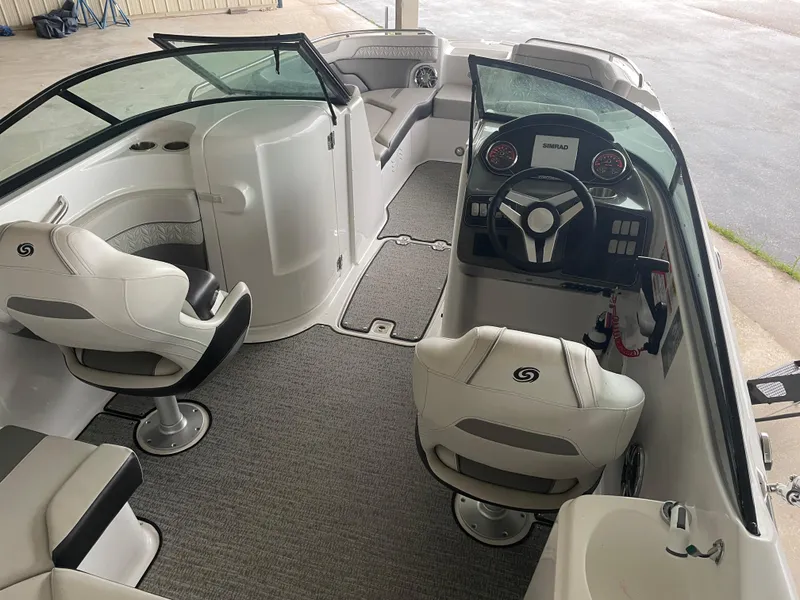 Slide: The Image of 2022 Hurricane SunDeck 2200 DC OB boat interior with seating and steering console. - 6