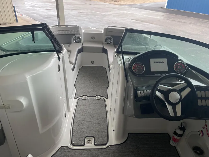 Slide: The Image of 2022 Hurricane SunDeck 2200 DC OB boat interior with steering wheel and dashboard. - 7