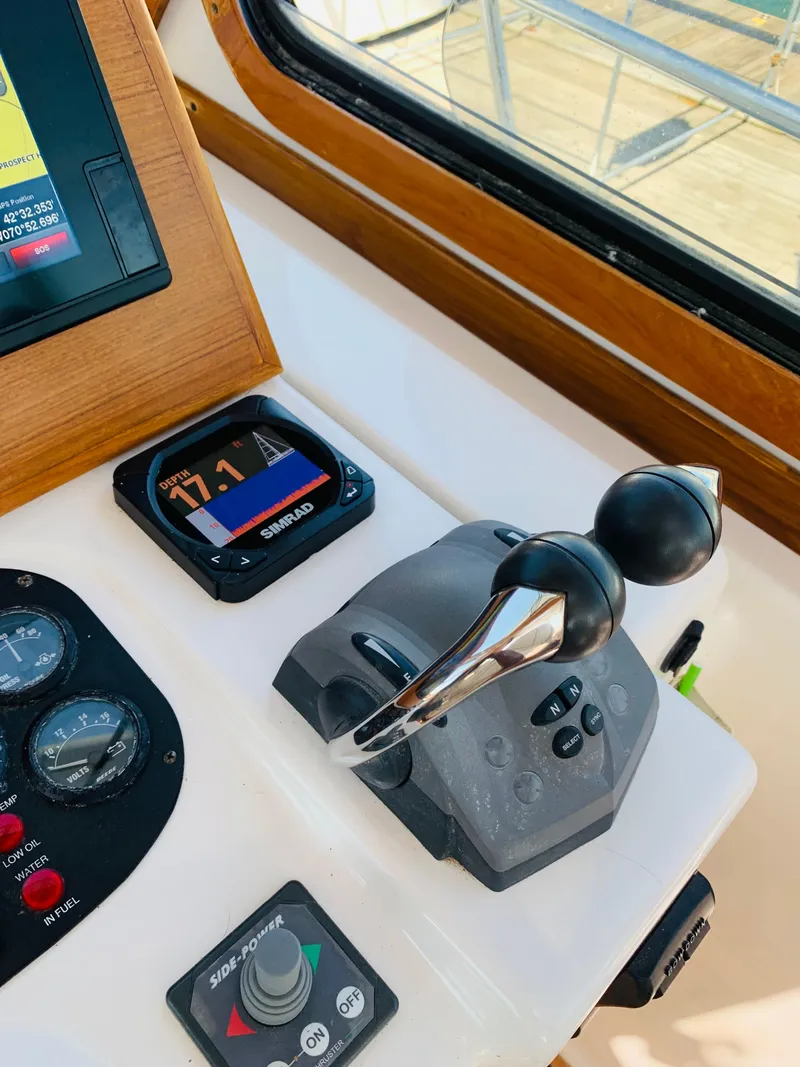 Slide: The Image of Control panel of 2004 Sabre 42 Hardtop Express yacht with throttle and gauges. - 20