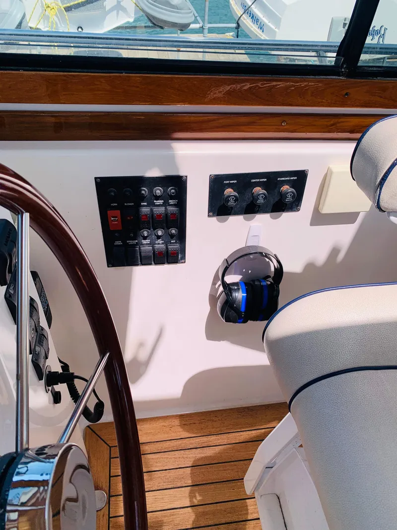 Slide: The Image of 2004 Sabre 42 Hardtop Express helm controls and steering wheel. - 23