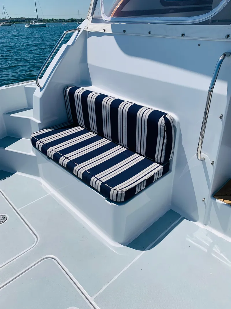 Slide: The Image of Striped seating on 2004 Sabre 42 Hardtop Express yacht deck. - 32