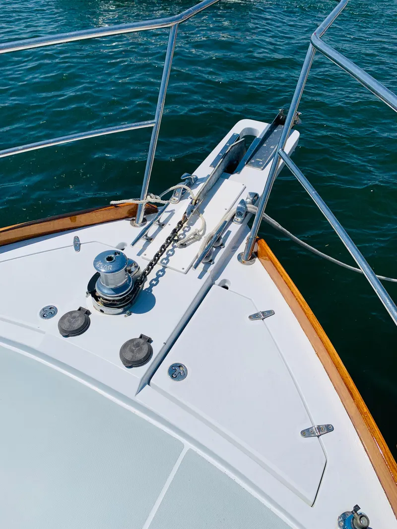 Slide: The Image of Bow of 2004 Sabre 42 Hardtop Express yacht with anchor and winch. - 35