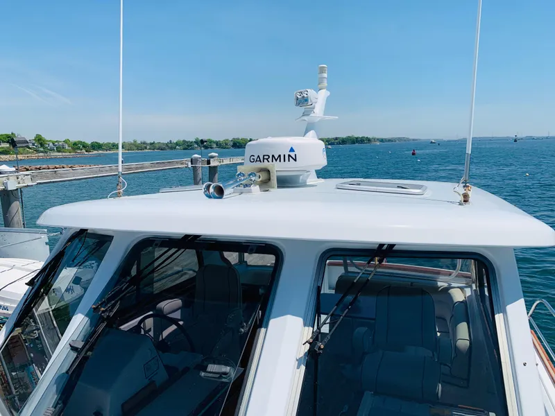 Slide: The Image of 2004 Sabre 42 Hardtop Express with Garmin radar on a sunny day at sea. - 36