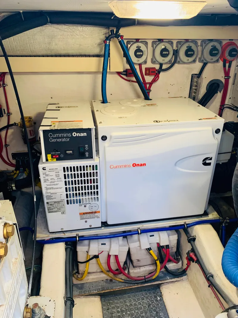 Slide: The Image of Engine room of 2004 Sabre 42 Hardtop Express with Cummins Onan generator. - 37