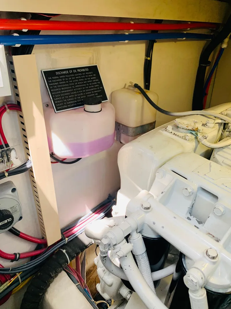 Slide: The Image of Engine room of 2004 Sabre 42 Hardtop Express with visible components and wiring. - 38