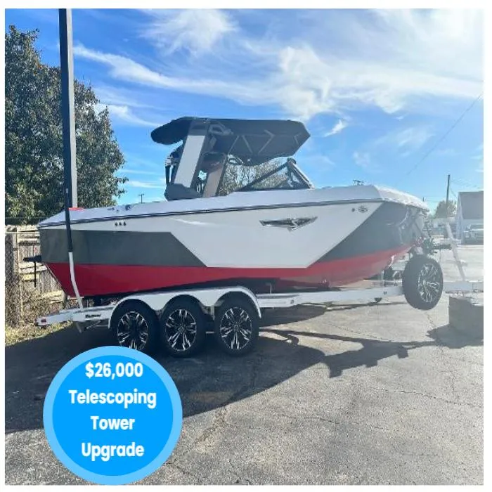 Slide: The Image of 2022 Nautique S23 boat with $26,000 telescoping tower upgrade on a trailer. - 0