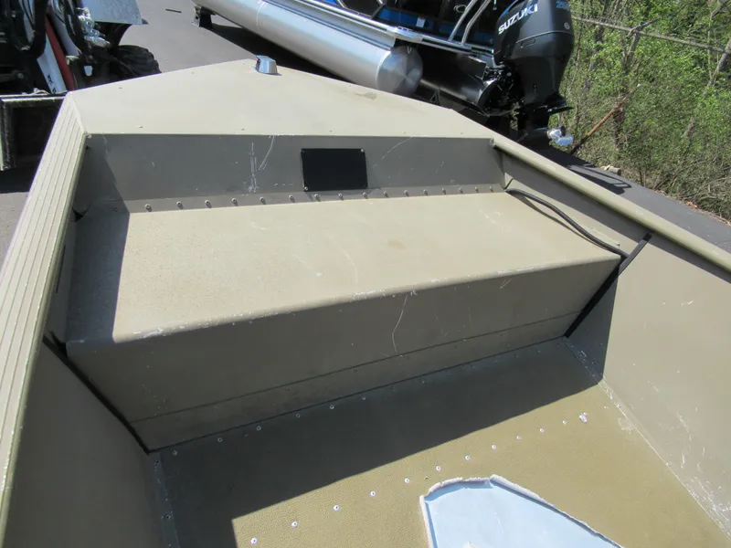 Slide: The Image of 2012 G3 1448 WOF boat interior with seating and motor in background. - 12