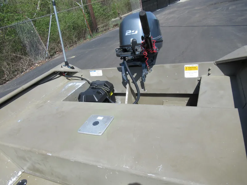 Slide: The Image of 2012 G3 1448 WOF boat with outboard motor in parking lot. - 14