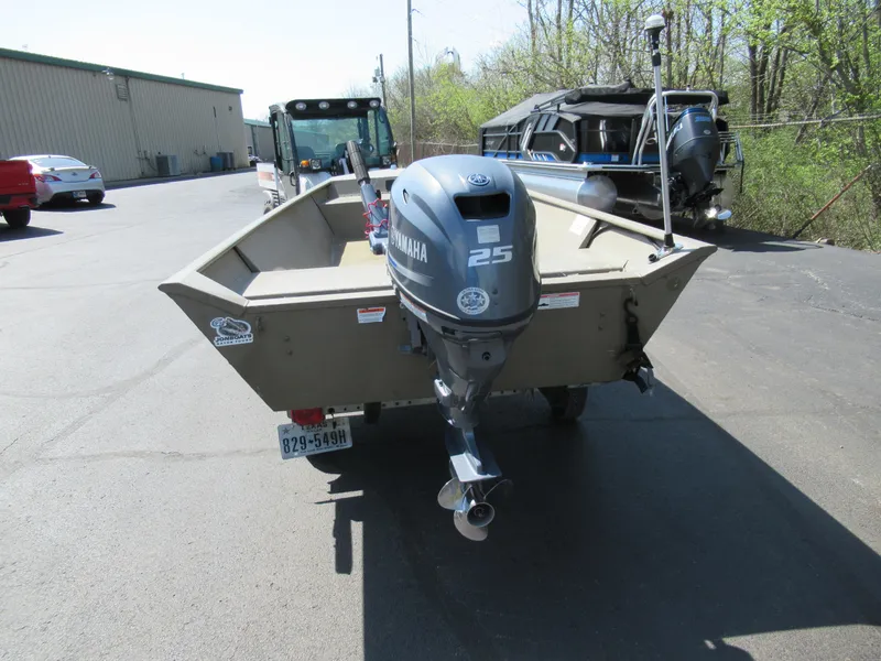 Slide: The Image of 2012 G3 1448 WOF boat with Yamaha 25 outboard motor in parking lot. - 2