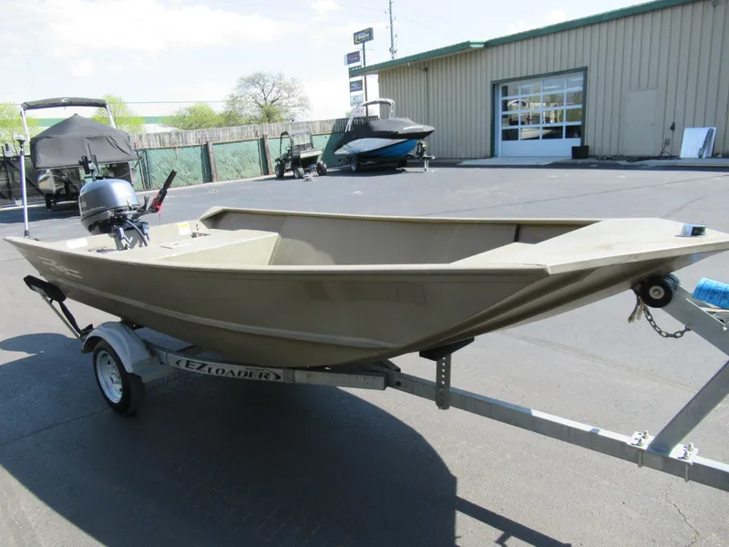 Slide: The Image of 2012 G3 1448 WOF boat on trailer in parking lot. - 5