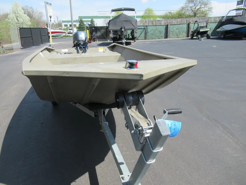 Slide: The Image of 2012 G3 1448 WOF boat on trailer in outdoor lot. - 6