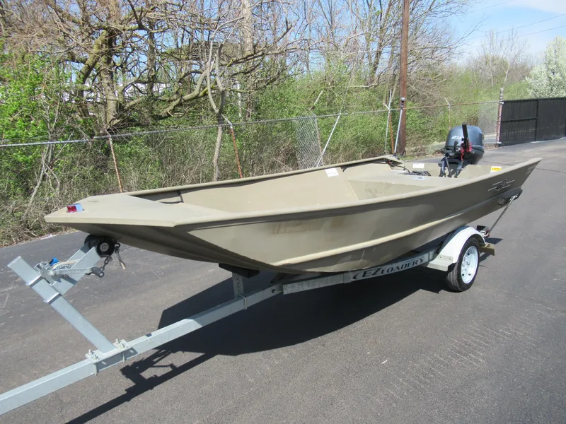 Slide: The Image of 2012 G3 1448 WOF boat on trailer, parked outdoors. - 8