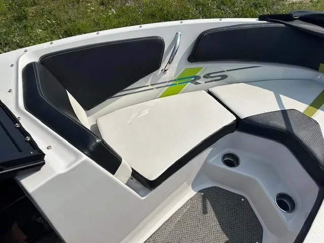 Slide: The Image of 2016 Four Winns H180 boat interior with cushioned seating and modern design. - 11