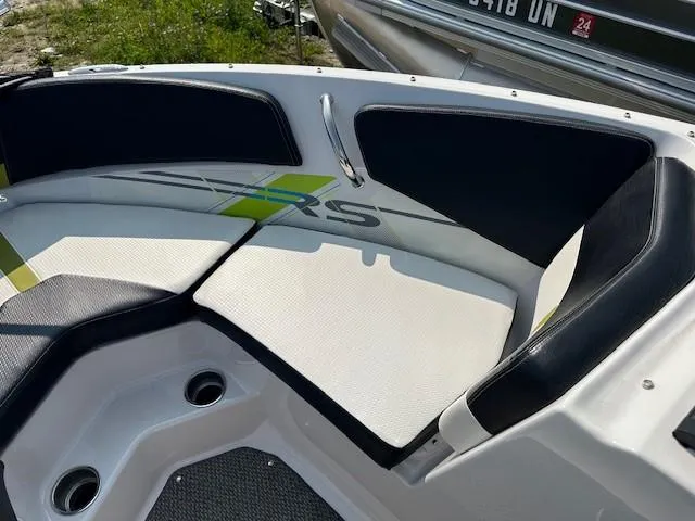 Slide: The Image of 2016 Four Winns H180 boat interior with cushioned seating and stylish design. - 12