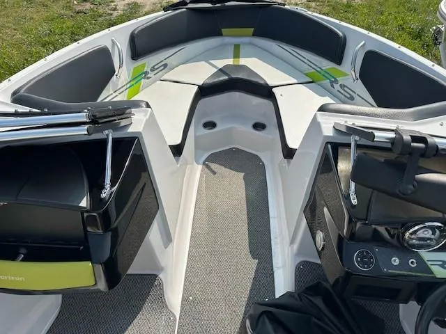 Slide: The Image of Interior view of 2016 Four Winns H180 boat, featuring seating and storage compartments. - 16