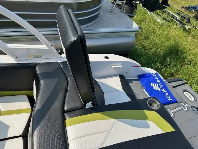 Slide: The Image of 2016 Four Winns H180 boat interior with black and yellow seating. - 20