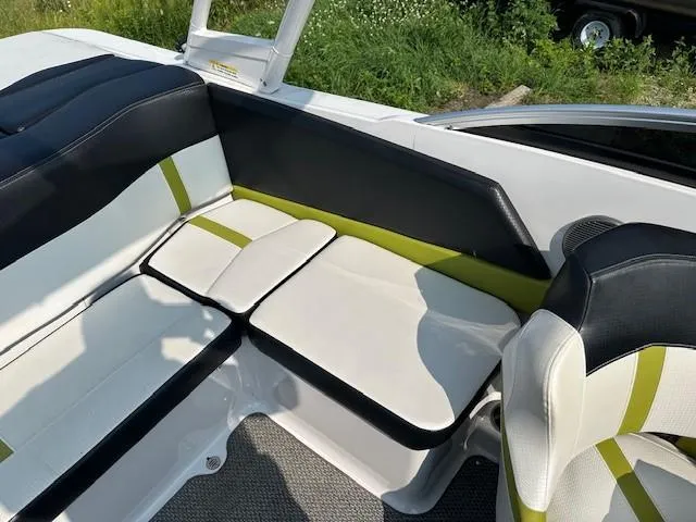 Slide: The Image of 2016 Four Winns H180 boat interior with stylish black and white seating. - 6