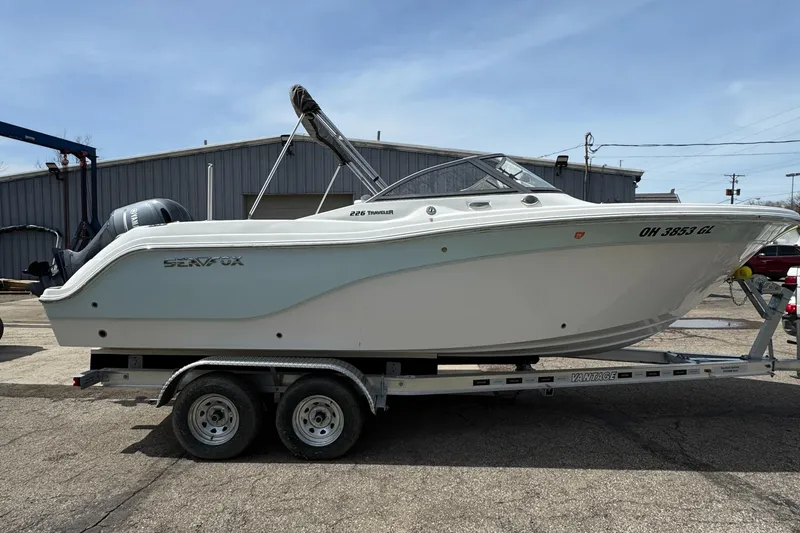 Slide: The Image of 2024 Sea Fox 226 Traveler boat on trailer, parked outdoors. - 11