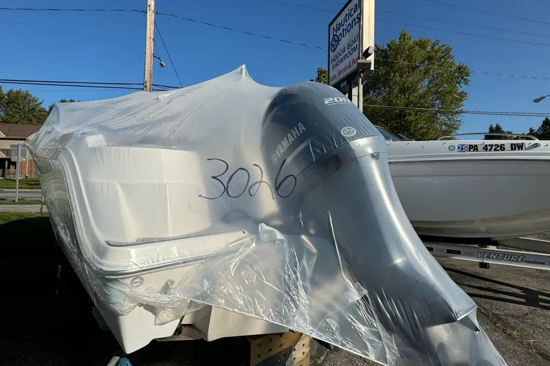 Slide: The Image of 2024 Sea Fox 226 Traveler boat wrapped in protective plastic with Yamaha engine. - 5
