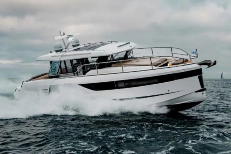 Slide: The Image of 2025 Wellcraft 44 Explorer yacht cruising on open water. - 42