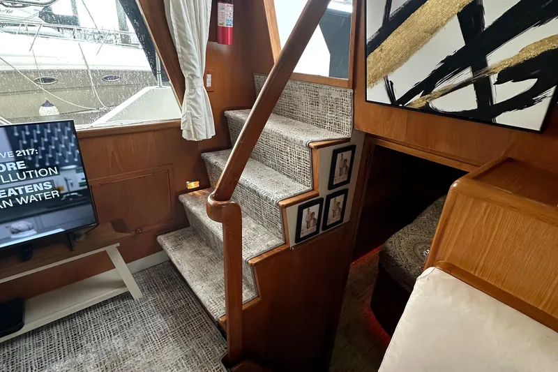 Slide: The Image of Interior of 1988 Ocean Alexander 42 aft cabin yacht with stairs and modern decor. - 6