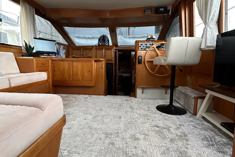 Slide: The Image of Interior of 1988 Ocean Alexander 42 aft cabin yacht with wood accents and helm station. - 7
