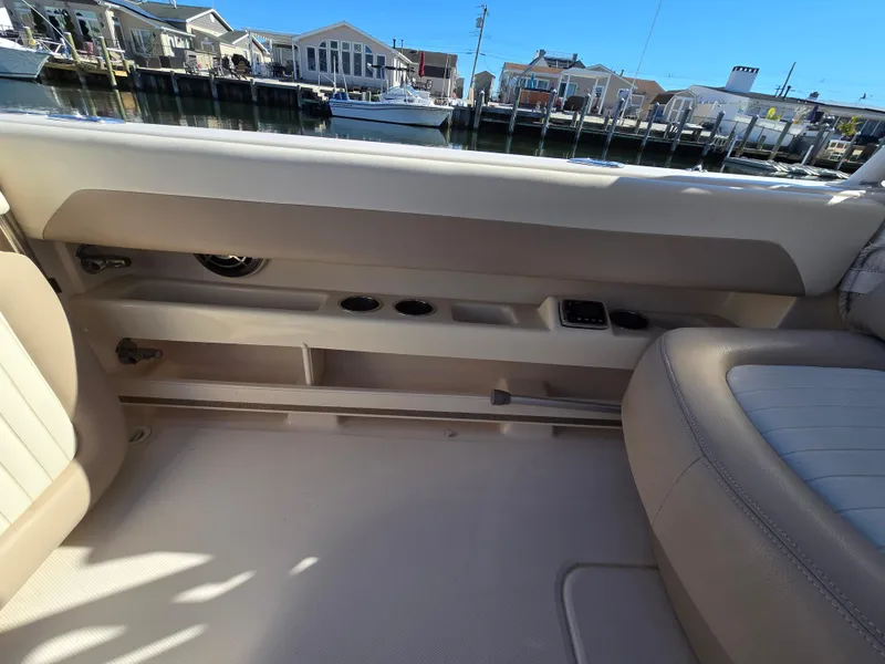 Slide: The Image of Interior view of 2014 Grady-White Freedom 307 boat, showcasing seating and storage compartments. - 11