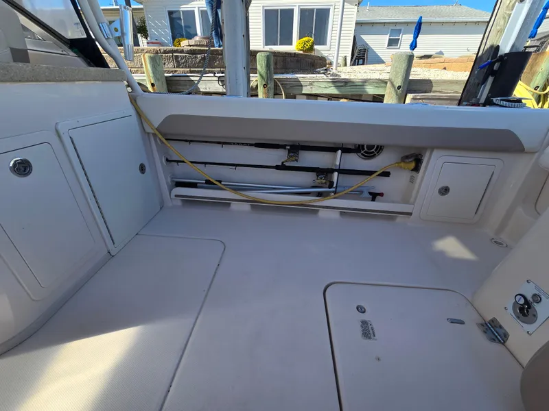 Slide: The Image of 2014 Grady-White Freedom 307 boat interior with storage compartments. - 28