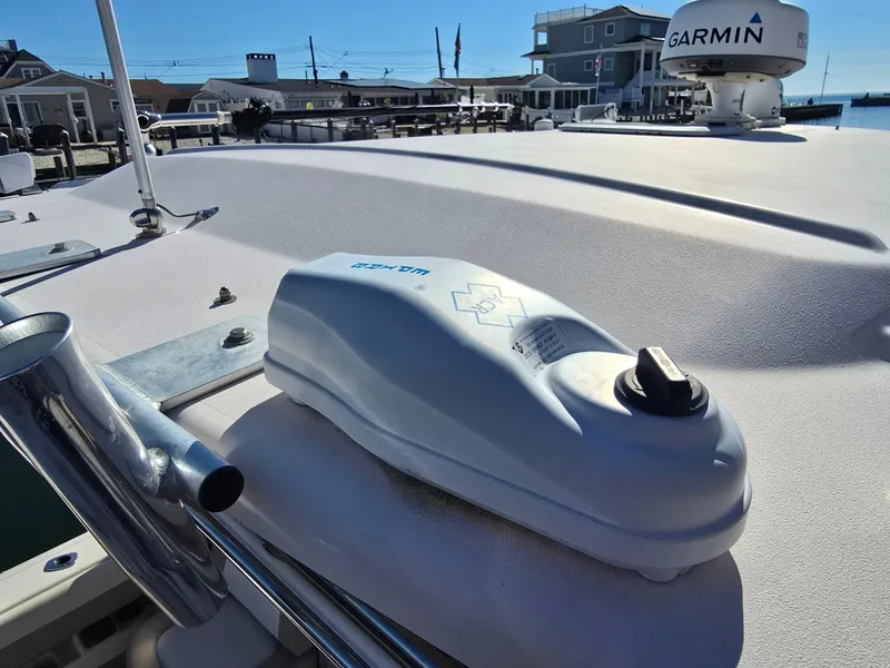 Slide: The Image of 2014 Grady-White Freedom 307 boat deck with Garmin equipment in a marina setting. - 29