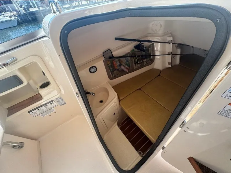 Slide: The Image of Interior cabin of 2014 Grady-White Freedom 307 boat with seating and storage. - 36