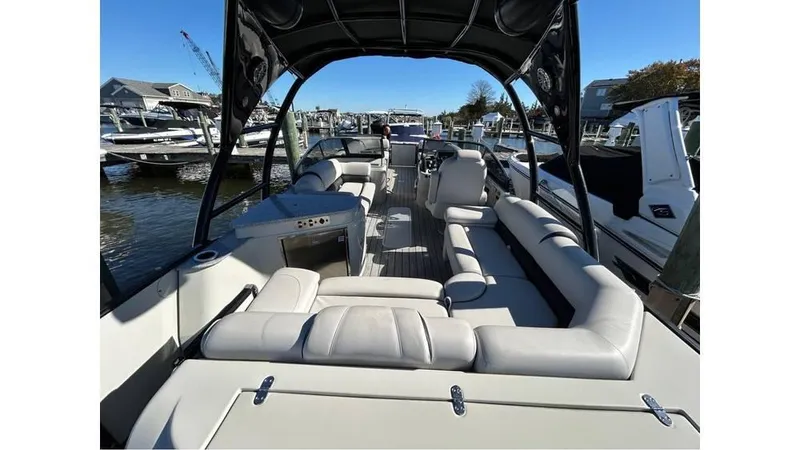 Slide: The Image of 2020 Avalon Catalina Platinum 2785 EL-W boat with spacious seating at a marina. - 12