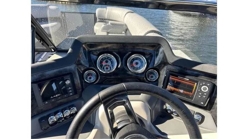 Slide: The Image of 2020 Avalon Catalina Platinum 2785 EL-W boat dashboard with gauges and controls. - 4