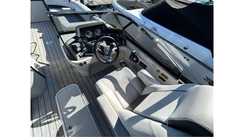 Slide: The Image of 2020 Avalon Catalina Platinum 2785 EL-W boat interior with steering wheel and seating. - 5