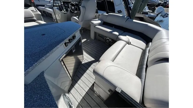 Slide: The Image of 2020 Avalon Catalina Platinum 2785 EL-W boat interior with luxurious seating and modern design. - 7