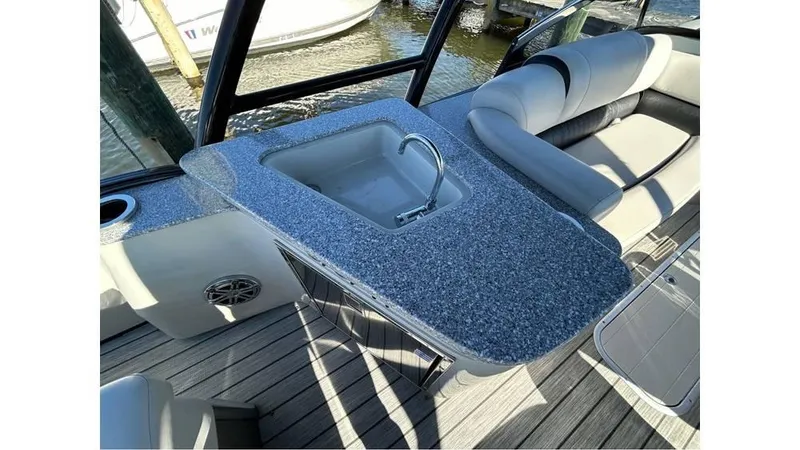 Slide: The Image of Luxurious 2020 Avalon Catalina Platinum boat interior with sink and seating area. - 9