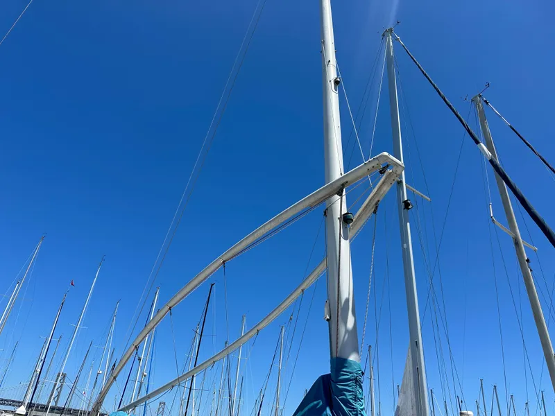 Slide: The Image of Sailboat mast of 1986 Nonsuch Ultra against clear blue sky. - 18
