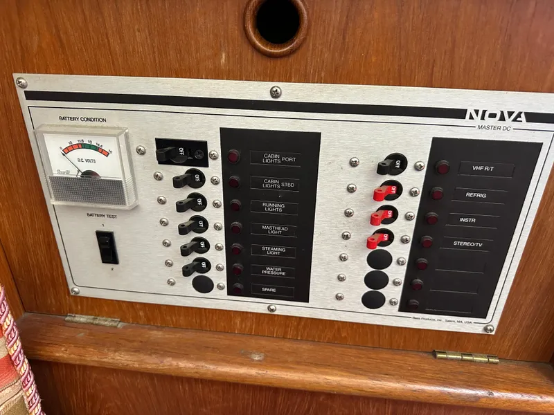 Slide: The Image of Electrical control panel on a 1986 Nonsuch Ultra boat, featuring switches and a voltage meter. - 9