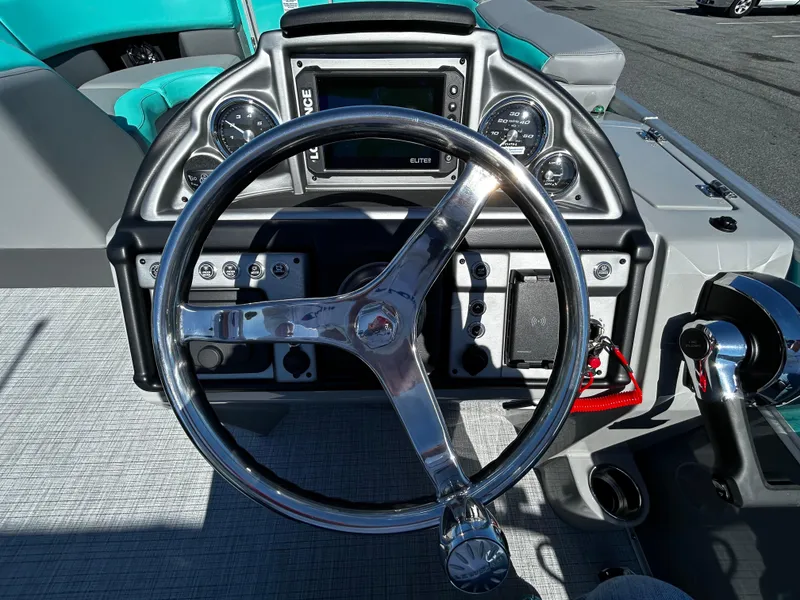 Slide: The Image of Steering wheel and dashboard of 2025 Berkshire 23RFX STS 3.0 boat. - 6