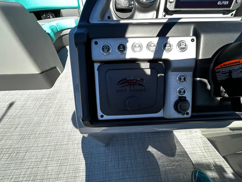 Slide: The Image of 2025 Berkshire 23RFX STS 3.0 boat dashboard with controls and gauges. - 9