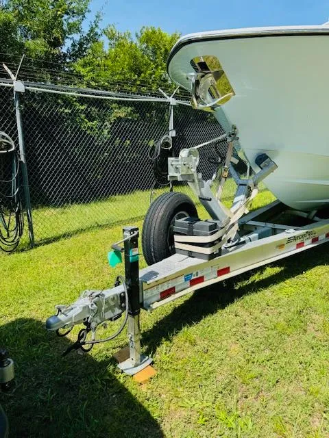 Slide: The Image of 2022 Invincible 36 Open Fisherman boat on trailer, parked on grass. - 22